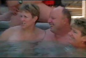 Busty mature woman in lingerie makes a guy company in bed